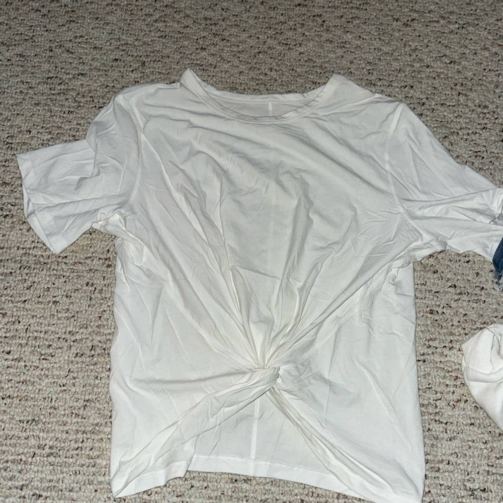 White Lululemon T-shirt with a knot in the front size medium